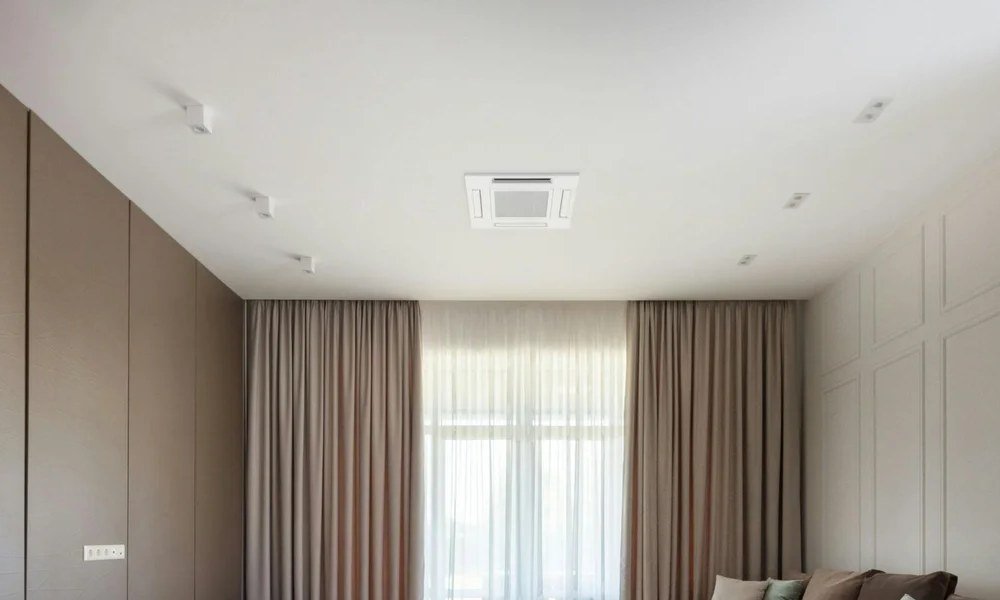 4-way ceiling cassette mini split installed flush in the ceiling of a modern Seattle-area living room by Le Bros Construction