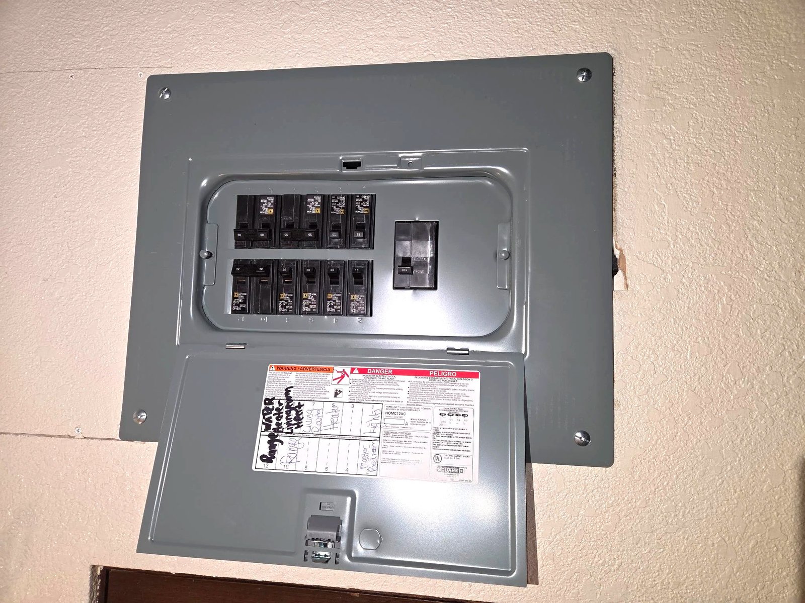 Finished 200-amp electrical panel upgrade by Le Bros Construction in Auburn WA, cover closed with circuit labels