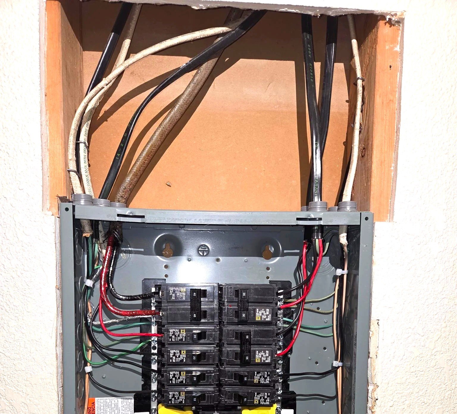 After apartment panel swap by Le Bros Construction — new Square D HOM 100A panel, clean wire routing, every circuit torqued to spec