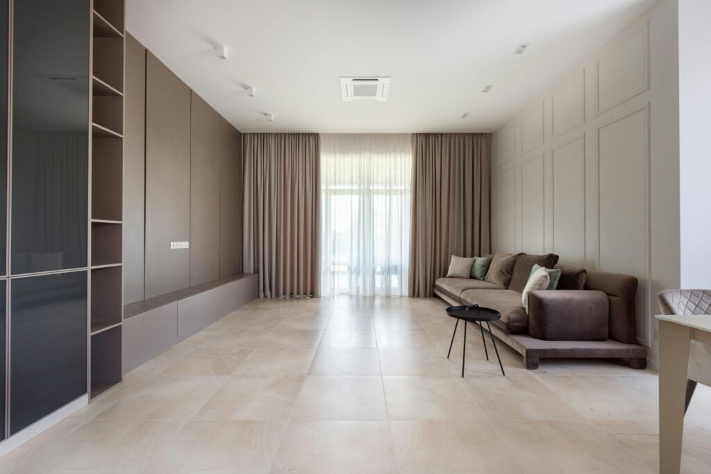 Ceiling cassette ductless mini split installed in a modern living room — only the grille is visible