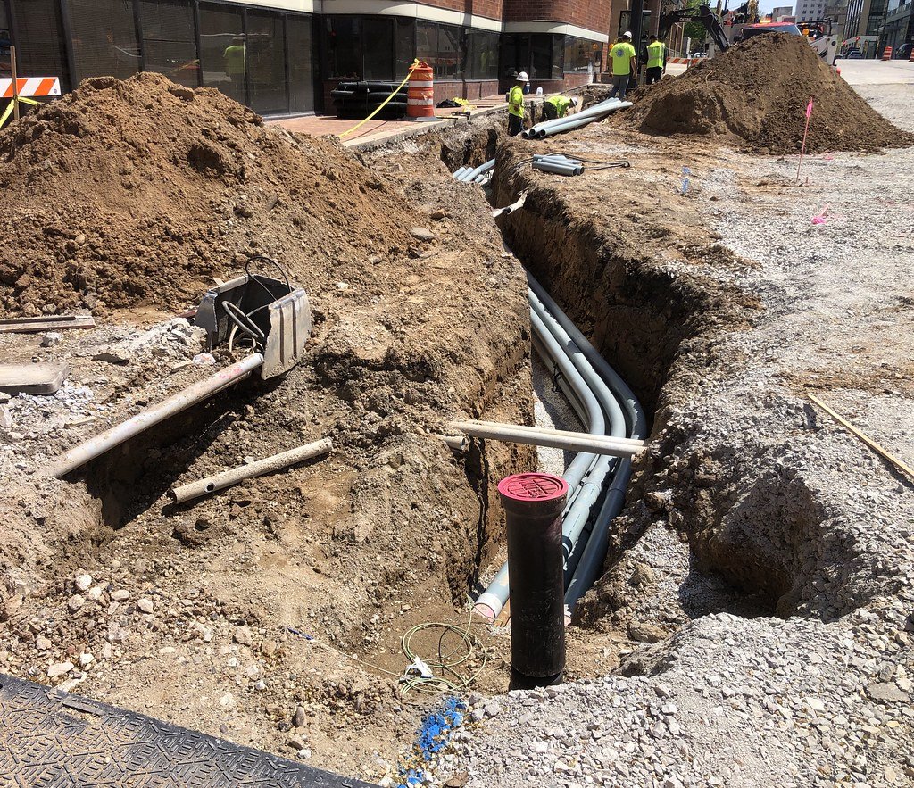 Underground electrical conduit being installed — required for running power from main house to DADU